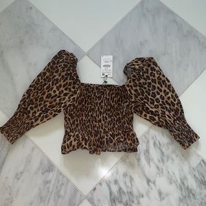 cheetah print top with puffed sleeves